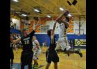 LaTroy Harper #24 flies in for two of his game leading 21 points against Lathrop.