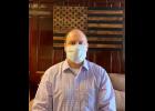 Senator Hoskins donned a surgical mask in his State Capitol office. All senators were provided with a mask to help prevent the transmission of the COVID-19 virus.