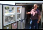 University of Missouri Extension specialist Bob Broz shows how to save money using a new mobile energy education unit. The classroom on wheels helps users view different types of doors, windows, insulation and lighting. Photo by  Linda Geist