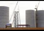 A $27 million grain-handling facility was being worked on in Hamilton on Wednesday. The project will consist of three 80-foot diameter grain silos and one 60-foot silo. The large silos will each have a 560,000 bushel capacity, while the smallest will be able to hold 316,000 bushels.