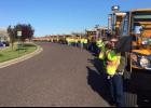 Co-workers of fallen worker Lyndon D. Ebker pay tribute on the day of his funeral.